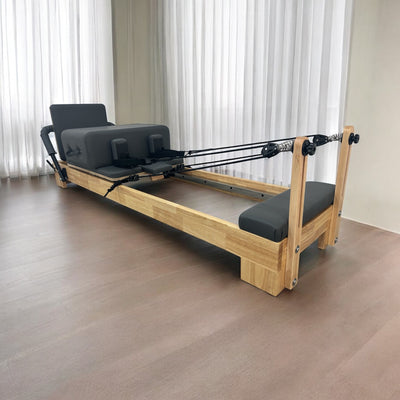 Side view of Eco Home Pilates Reformer – premium oak wood reformer pilates machine for home use.