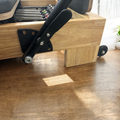 Close-up of foot bar and carriage on Eco Home Pilates Reformer – durable pilates reformer machine with adjustable features.