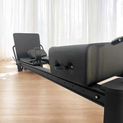 Close-up of Queen Reformer’s padded carriage and gliding track