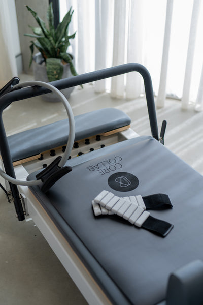 Queen Reformer Tower with Half Trapeze – Side Angle